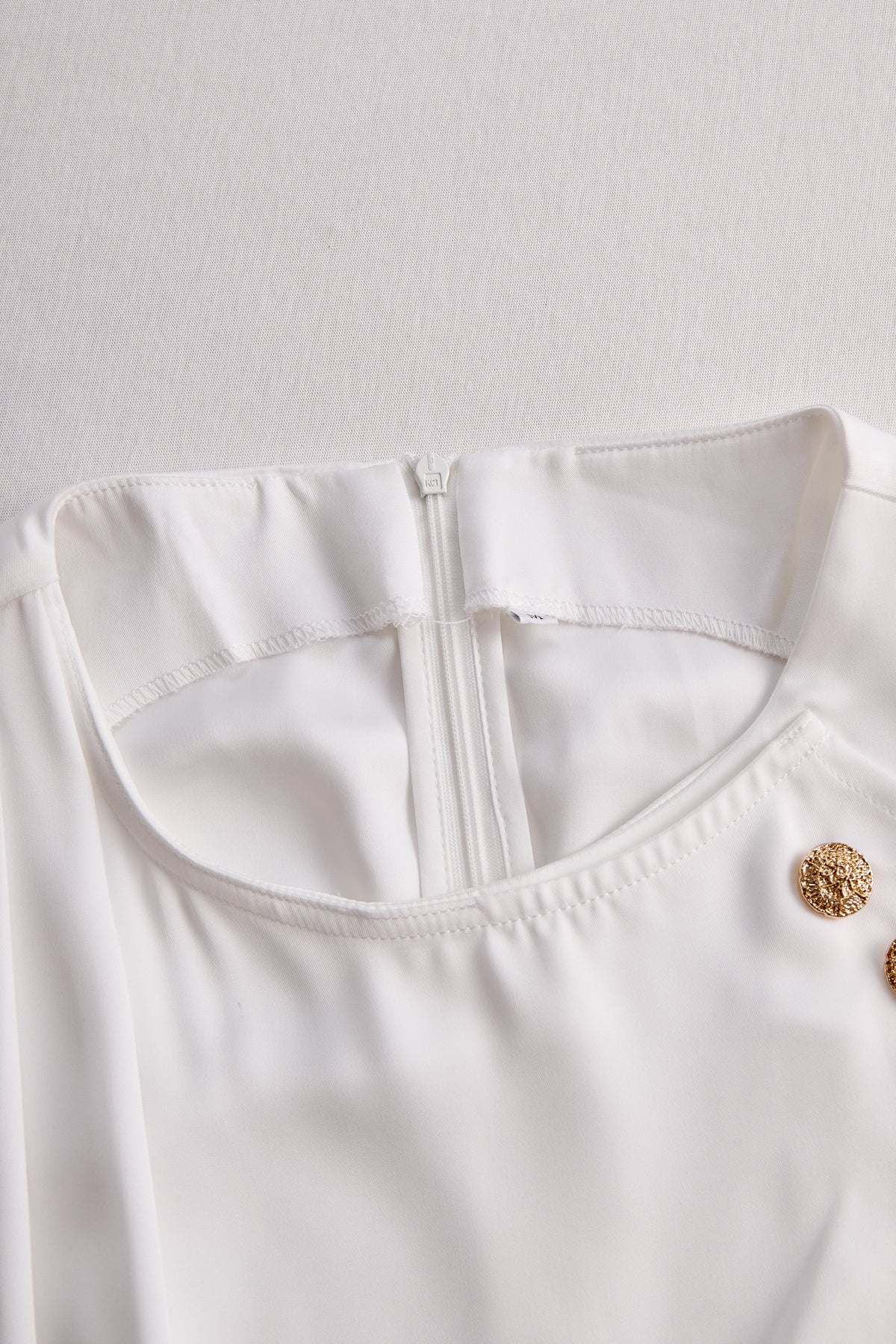 Elegant White Draped Top with Button Detail