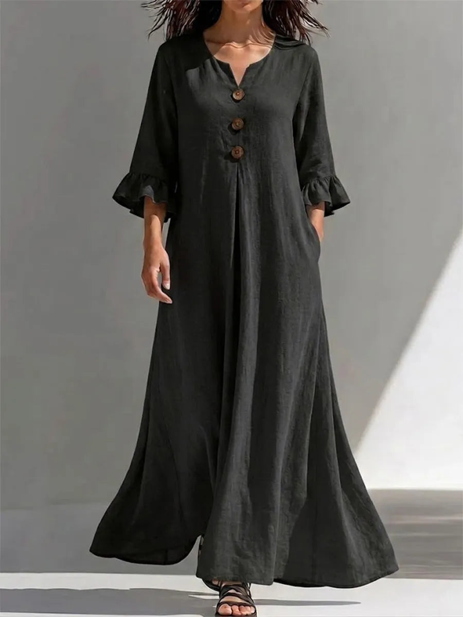 Long Dress Featuring A Partial Button-front, Gathered Details, Ruffled Three-quarter Sleeves, And A Flattering, Figure-concealing Fit